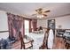 Dining room is naturally lit and features wood floors, a ceiling fan, and a glass door at 3360 E Main St, Danville, IN 46122
