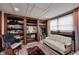 Carpeted dressing room with custom built-in shelves, cabinets and a vanity area at 3360 E Main St, Danville, IN 46122
