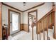 Inviting foyer features wood trim, neutral carpet, and staircase to the upper level at 3360 E Main St, Danville, IN 46122