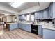 Traditional kitchen with light blue cabinets, ample countertop space, and updated appliances at 3360 E Main St, Danville, IN 46122
