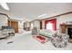 Expansive carpeted living room with a fireplace, wood trim, and plenty of seating at 3360 E Main St, Danville, IN 46122