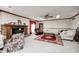 Cozy living room with a brick fireplace, ceiling fan and comfortable seating arrangement at 3360 E Main St, Danville, IN 46122