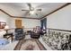 Cozy living room showcases comfortable seating, a ceiling fan, and a floral patterned rug at 3360 E Main St, Danville, IN 46122