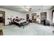 A bedroom with carpet, ceiling fan, a bed, and an ensuite bathroom at 3360 E Main St, Danville, IN 46122
