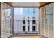 Balcony view featuring metal bars, glass doors, and a cityscape at 355 E Ohio St # 309, Indianapolis, IN 46204