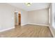 Spacious bedroom with wood floors and neutral walls offers a calm, inviting space at 355 E Ohio St # 309, Indianapolis, IN 46204