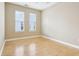 Bright bedroom with hardwood floors and two windows for ample natural light at 355 E Ohio St # 309, Indianapolis, IN 46204
