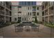 Exterior courtyard with water feature and seating at 355 E Ohio St # 309, Indianapolis, IN 46204