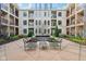 Courtyard featuring center decorative water feature and seating and residential balconies at 355 E Ohio St # 309, Indianapolis, IN 46204