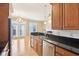 Modern kitchen featuring granite countertops, stainless steel appliances, and hardwood floors at 355 E Ohio St # 309, Indianapolis, IN 46204