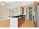 Modern kitchen with granite countertop, stainless steel appliances, and a staircase at 355 E Ohio St # 309, Indianapolis, IN 46204
