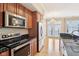 Well-equipped kitchen features stainless steel appliances, granite countertops, and wood cabinets at 355 E Ohio St # 309, Indianapolis, IN 46204