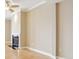 View of a room with walls painted in a creamy color and a black marble fireplace at 355 E Ohio St # 309, Indianapolis, IN 46204