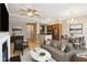 Open-concept living area with modern decor, hardwood floors, sofa, and seamless connection to the kitchen and dining space at 355 E Ohio St # 309, Indianapolis, IN 46204