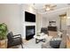 Bright living room with a fireplace, television, stylish furniture, and plenty of space for relaxation at 355 E Ohio St # 309, Indianapolis, IN 46204