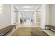 Lobby with bench seating on carpet and tile with view of lounge beyond pillars at 355 E Ohio St # 309, Indianapolis, IN 46204