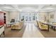 Comfortable lounge area with ample seating, neutral colors, and french doors with courtyard view at 355 E Ohio St # 309, Indianapolis, IN 46204