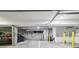 Well-lit parking garage space with clearly marked lines, providing secure and convenient parking for residents at 355 E Ohio St # 309, Indianapolis, IN 46204