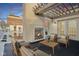 Inviting rooftop patio features a fireplace, pergola, comfortable seating, and city views for relaxing outdoor living at 355 E Ohio St # 309, Indianapolis, IN 46204