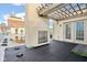 Spacious rooftop patio with outdoor fireplace and wooden pergola, perfect for entertaining with a city view at 355 E Ohio St # 309, Indianapolis, IN 46204