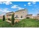 Large backyard featuring a patio, swing, fire pit, and well-maintained lawn, perfect for relaxation at 371 Bluestem Ln, Whiteland, IN 46184