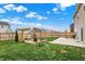 Beautiful backyard with a brick fire pit, swing set, mature trees, and ample green space at 371 Bluestem Ln, Whiteland, IN 46184