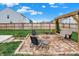 Backyard patio area with a fire pit and comfortable seating perfect for outdoor entertaining at 371 Bluestem Ln, Whiteland, IN 46184