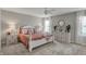 Comfortable bedroom with plush bedding, two side tables, neutral decor and plush carpeting at 371 Bluestem Ln, Whiteland, IN 46184