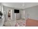 Relaxing bedroom features plush carpet, neutral walls, a TV, and a spacious walk-in closet at 371 Bluestem Ln, Whiteland, IN 46184