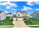Charming two-story home featuring a spacious three-car garage and well-maintained lawn at 371 Bluestem Ln, Whiteland, IN 46184