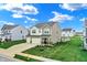 Charming two-story home featuring a spacious three-car garage and well-maintained lawn at 371 Bluestem Ln, Whiteland, IN 46184