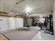 Spacious garage area with ample storage, a large door, and an exercise area at 371 Bluestem Ln, Whiteland, IN 46184