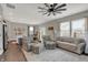 Bright living room with large windows, comfortable seating, and stylish decor at 371 Bluestem Ln, Whiteland, IN 46184