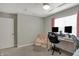 Cozy office space with a plush chair and a well-equipped desk with monitors at 371 Bluestem Ln, Whiteland, IN 46184