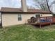 Exterior of home with deck, chimney, siding and grassy backyard at 3817 Cologne Ct, Indianapolis, IN 46228