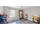 Bright bedroom featuring a large full body mirror and ample natural light at 3817 Cologne Ct, Indianapolis, IN 46228