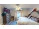Relaxing bedroom with a large window, ceiling fan and dresser with TV at 3817 Cologne Ct, Indianapolis, IN 46228