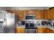 Well-equipped kitchen with stainless steel appliances and a tiled backsplash at 3817 Cologne Ct, Indianapolis, IN 46228