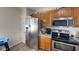Functional kitchen with stainless steel appliances, ample cabinet space, and granite countertops at 3817 Cologne Ct, Indianapolis, IN 46228