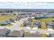 Aerial view of a residential neighborhood showcasing many homes and green spaces at 3999 Kensington Dr, Danville, IN 46122