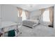 Stylish bedroom featuring carpet, neutral walls, and a comfortable bed with padded headboard at 3999 Kensington Dr, Danville, IN 46122