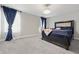 Bedroom with carpeting, padded headboard, and natural light from the window at 3999 Kensington Dr, Danville, IN 46122