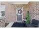 Charming front porch with a decorated entrance and seating at 3999 Kensington Dr, Danville, IN 46122