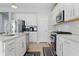 Well-designed kitchen with white cabinets, modern appliances, and a functional layout at 3999 Kensington Dr, Danville, IN 46122