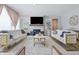 Bright living room boasts a fireplace, modern decor and comfortable seating arrangements at 3999 Kensington Dr, Danville, IN 46122
