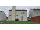 The backyard showcases the home's exterior, including a sliding door and windows at 4063 Orchard Valley Blvd, Indianapolis, IN 46235