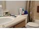 Bathroom featuring a sink, toilet, and toiletries in neutral, clean tones at 4063 Orchard Valley Blvd, Indianapolis, IN 46235