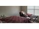 Bedroom with a bed, an armchair, and a window that brings in natural light at 4063 Orchard Valley Blvd, Indianapolis, IN 46235