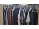 Organized closet filled with clothes, offering ample storage space for the homeowner at 4063 Orchard Valley Blvd, Indianapolis, IN 46235