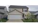 Charming two-story home with a two car garage and neatly maintained landscaping at 4063 Orchard Valley Blvd, Indianapolis, IN 46235